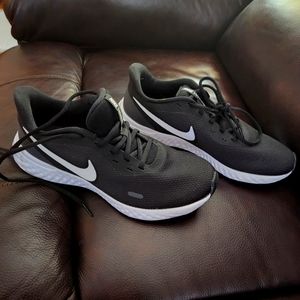 Women's black Nike Revolution running shoes. Size 9.5
